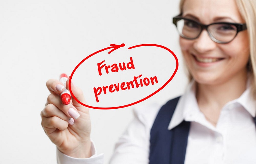 internet, business and marketing. Young business woman writing word: fraud prevention